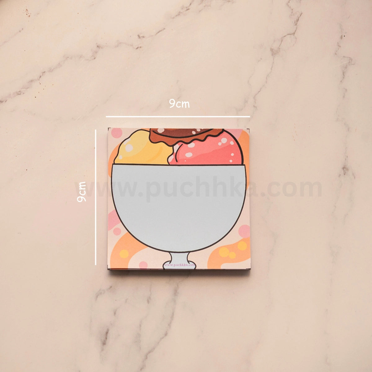 A square coaster featuring a cute illustration of a sundae in a glass bowl, shown on a light marble background with white dimension lines indicating a 9cm by 9cm size.