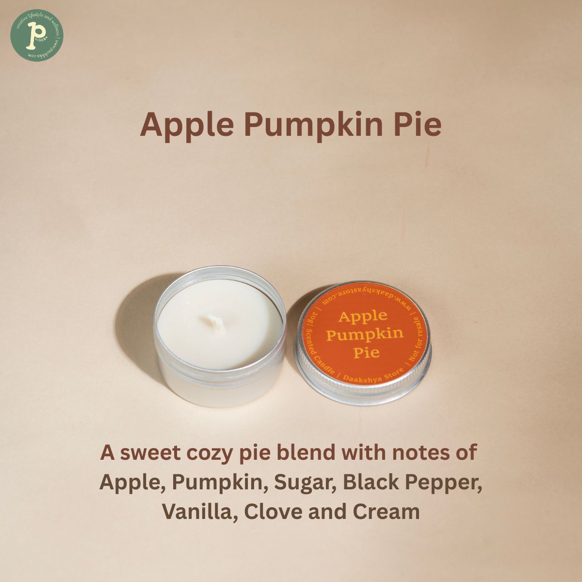 Apple Pumpkin Pie Scented Candle is on a beige background with notes of "Apple, Pumpkin, Sugar, Black Pepper, Vanilla, Clove and Cream " written at the bottom.