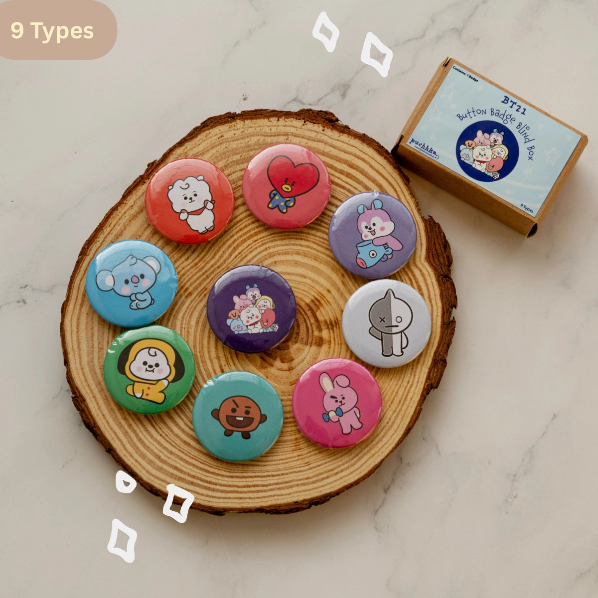 Nine round BT21 pinback buttons displayed on a round wood coaster, with a small branded box at the top right. The buttons feature colorful BTS's BT21 characters and include a variety of hues, making the product color identity best classified as Multicolor.