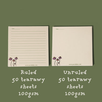 Two cream-colored ConeFlowers memopads shown on a muted green background, one ruled and one unruled, with text indicating 50 tearaway sheets and 100gsm weight.