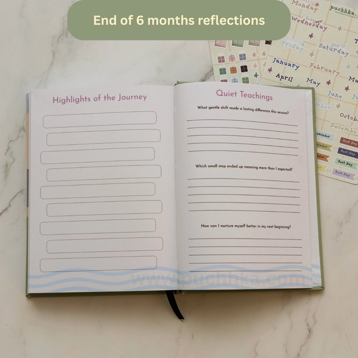 An open journal or planner spread on a light marble surface, showing two reflection pages titled 'Highlights of the Journey' and 'Quiet Teachings,' with additional sticker sheets in the background. A green banner at the top reads 'End of 6 months reflections.