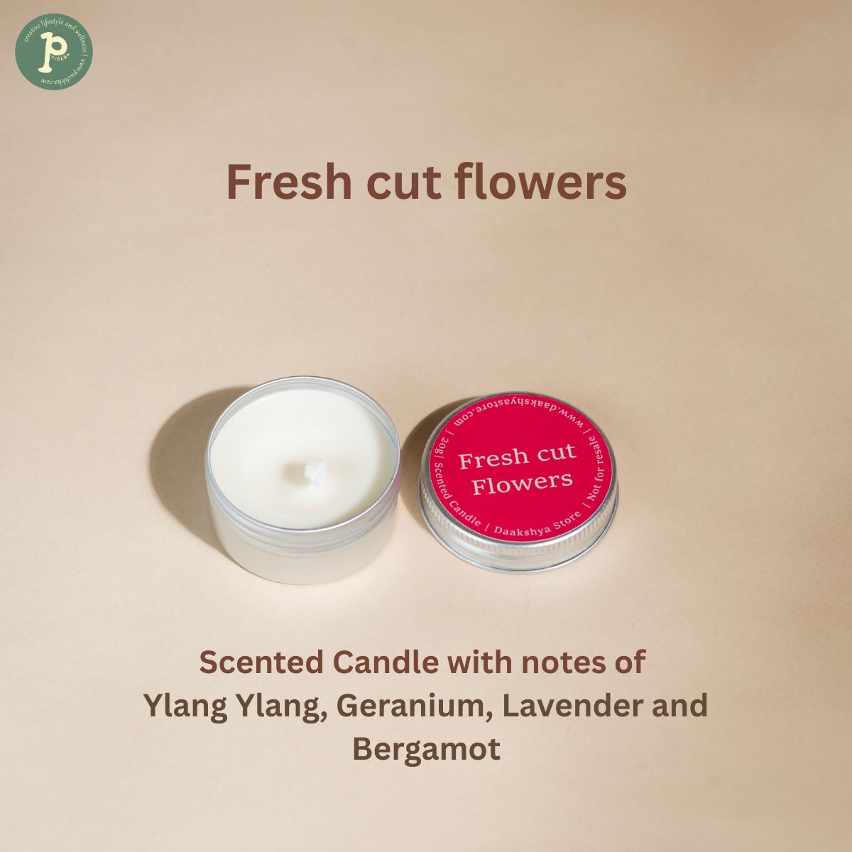 Fresh cut flowers scented mini candle is on a beige background with notes of "ylang ylang, geranium, lavender and bergamot" is written at the bottom.