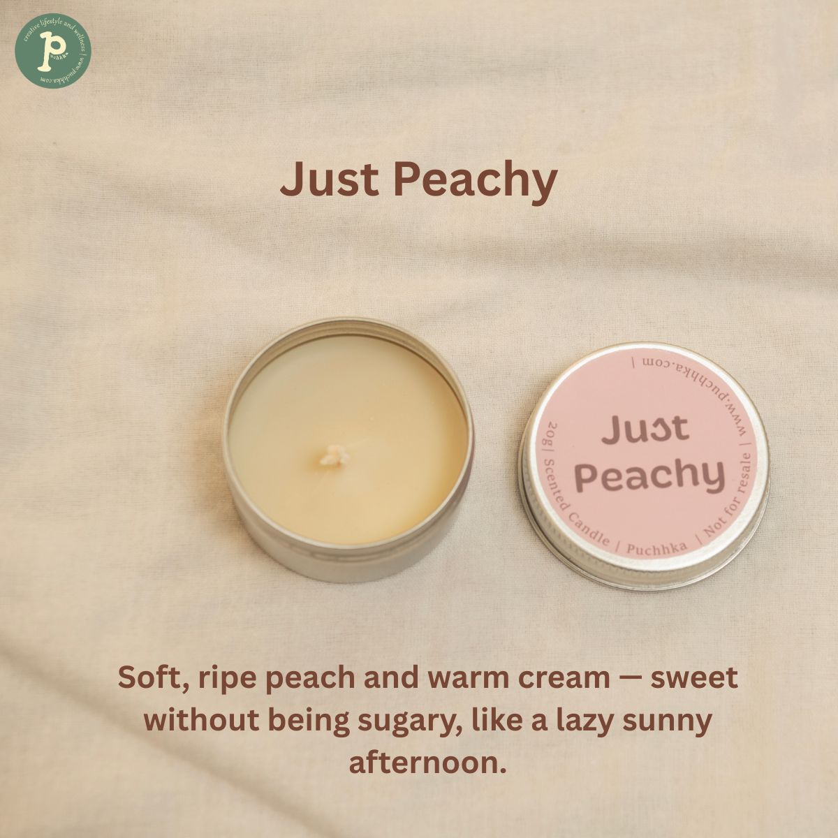 Just Peachy Scented mini Candle is on a linen background with notes of Peach and warm cream written at the bottom