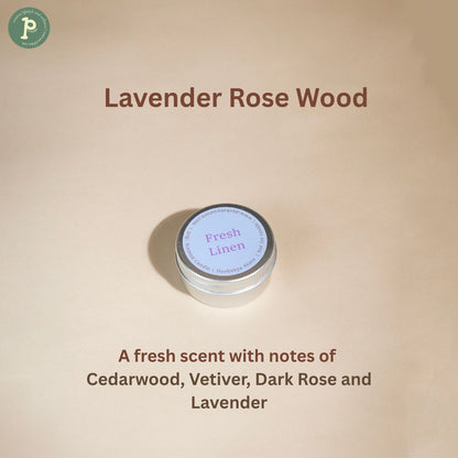 Lavender Rose Wood scented Candle is on a beige background with notes of "Cedarwood, Vetiver, Dark Rose and Lavender" written at the bottom.