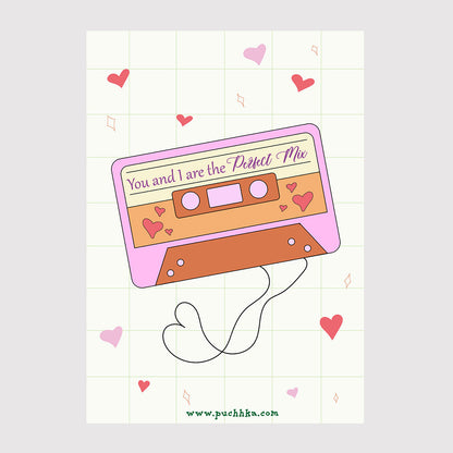 A retro cassette tape illustration with the phrase 'You and I are the Perfect Mix' in purple script. The cassette is pink and orange-brown, decorated with small hearts, and is shown on a pale grid background with scattered pink hearts.