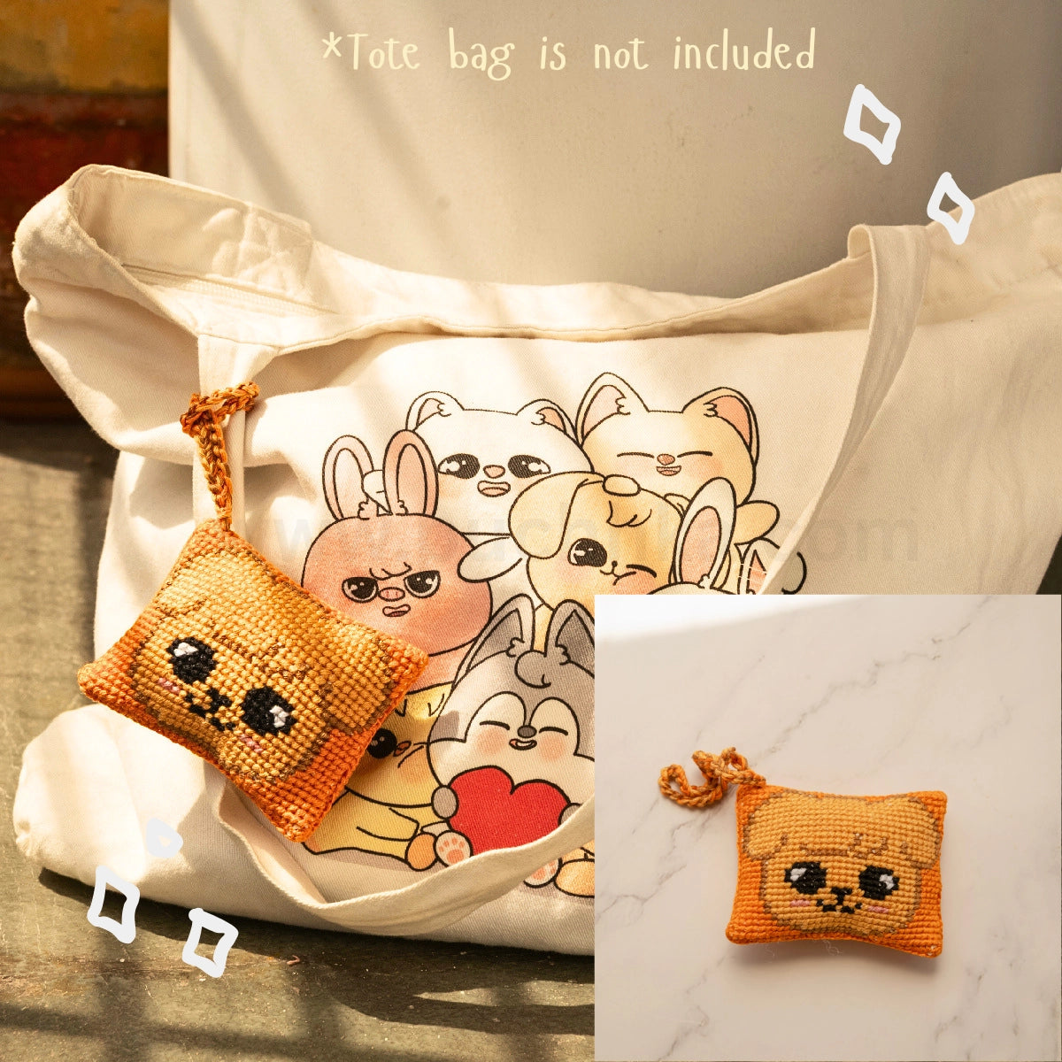 A cream canvas tote bag with a printed skzoo illustration on the front, shown alongside a small Orange and Brown cross-stitch style skzoo bag hanging with a matching strap. The image includes text stating '*Tote bag is not included' and a small inset showing the pouch alone on a marble surface.