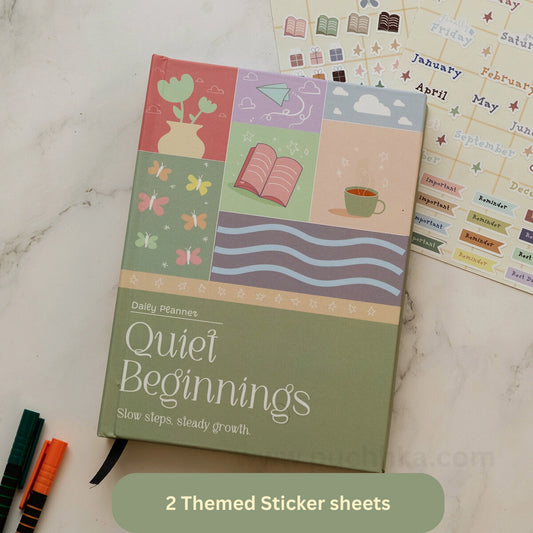 A Daily Plans 'Quiet Beginnings' planner notebook with a pastel patchwork cover, displayed on a light marble surface next to sticker sheets and colored pencils. A green banner at the bottom reads '2 Themed Sticker sheets'.