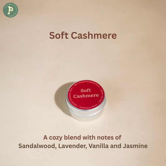 Soft Cashmere scented candle is on a beige background with notes "Sandalwood, Lavender, Vanilla and Jasmine"written at the bottom