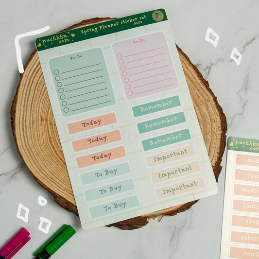A spring planner sticker set by Puchhka displayed on a rustic wood slice coaster.