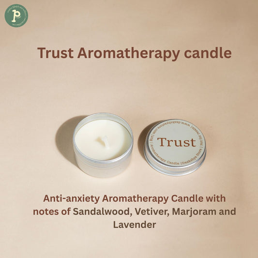 Trust mini 20g candle on a beige background with scent notes "Sandalwood, Vetiver, Marjoram and Lavender" written at the bottom.