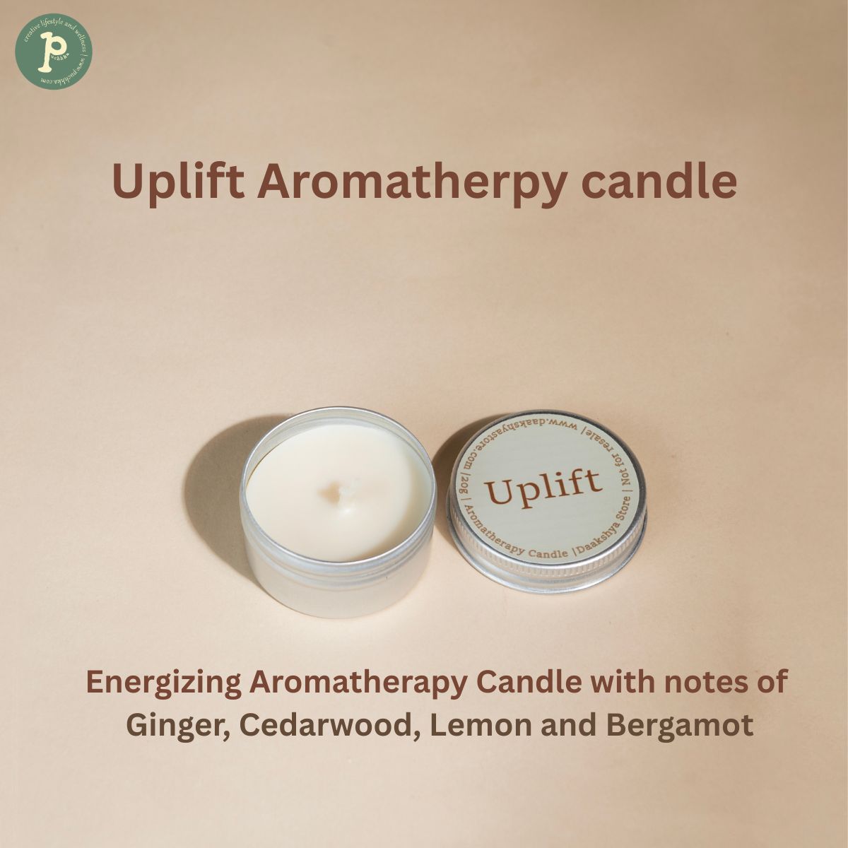 Uplift Aromatherapy mini candle 20g is kept on a beige background with scent notes "Ginger, Cedarwood, Lemon and Bergamot" written at the bottom.